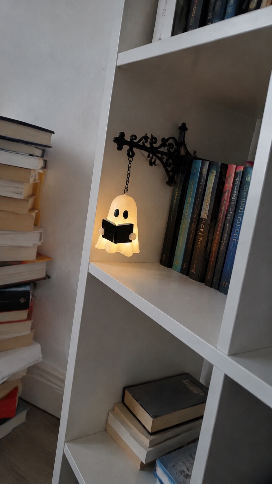 Illustrative at-home scene featuring Ghost Bookshelf Light